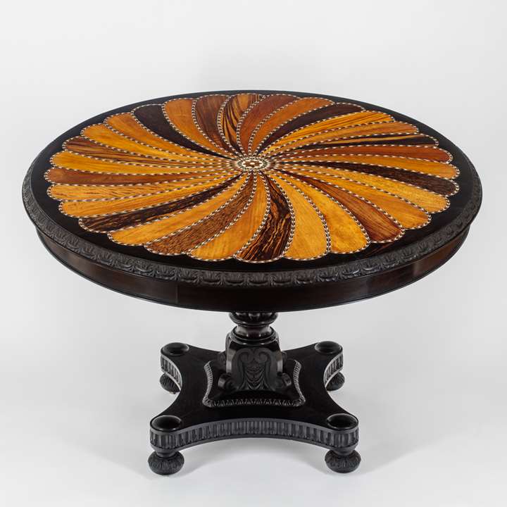 A large Ceylonese Ebony and Specimen Wood Centre Table